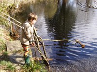 Callum playing by the pond at Laurieston