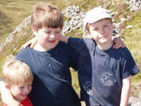 Blue, Saul and Callum on top of An Sgurr, Isle of Eigg Blue, Saul and Callum on top of An Sgurr, Isle of Eigg